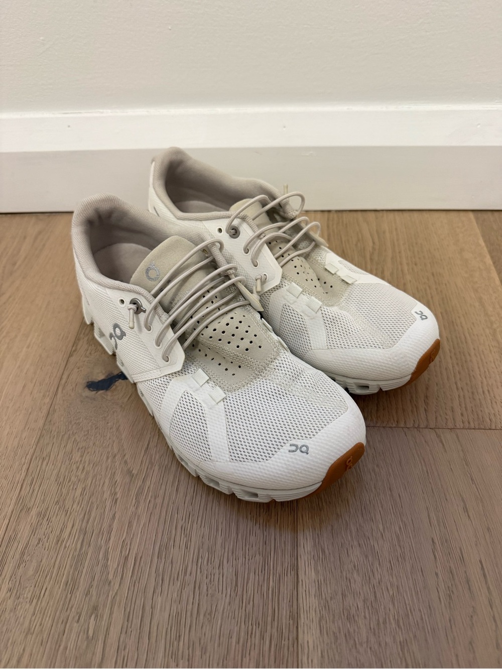 On Running Cloud Shoes in Off-White with Gum Accents